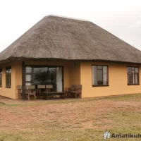 Spacious 7-sleeper self-catering chalet at Mpila Camp with five beds and a private veranda in Hluhluwe-iMfolozi Game Reserve, South Africa