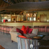 Bar at Didima Camp – relaxed social space for guests to enjoy drinks with mountain views in the Drakensberg, South Africa