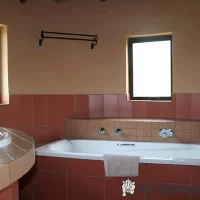Bathtub at Didima Camp – comfortable bathroom feature in chalet accommodation in the Drakensberg, KwaZulu-Natal, South Africa