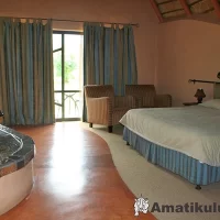 Bedroom at Didima Camp – cosy accommodation with mountain-inspired decor in the Drakensberg, KwaZulu-Natal, South Africa