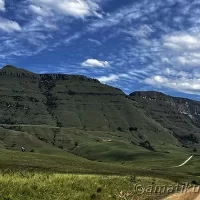 Rural roads leading to Injisuthi Camp, winding through scenic valleys and mountains in uKhahlamba-Drakensberg Park, South Africa