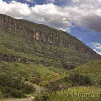 Scenic mountain landscape surrounding Injisuthi Camp in uKhahlamba-Drakensberg Park, featuring dramatic peaks and lush valleys in South Africa