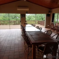 Dining room at Ndumo Game Reserve featuring rustic decor and views of the surrounding wetlands in KwaZulu-Natal, South Africa