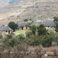 Chalets at Thendele Lower Camp surrounded by natural vegetation in Royal Natal National Park, Drakensberg, South Africa